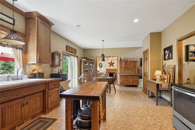56 Hicks Rd, Donegal Twp Wsh, PA 15376 - kitchen featuring stainless steel electric range oven, wooden counters, decorative light fixtures, brown cabinetry, and recessed lighting