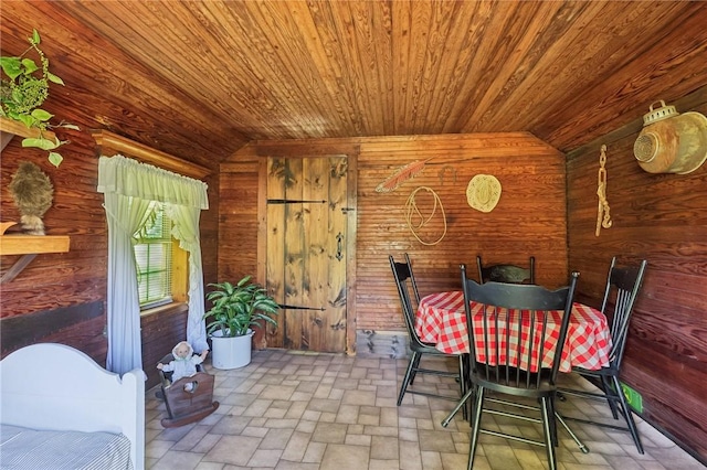 56 Hicks Rd, Donegal Twp Wsh, PA 15376 - dining area with wooden ceiling, lofted ceiling, wood walls, and brick patterned flooring