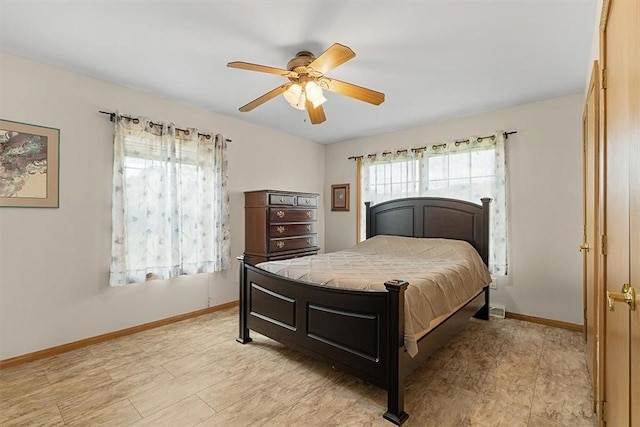 bedroom featuring baseboards and a ceiling fan