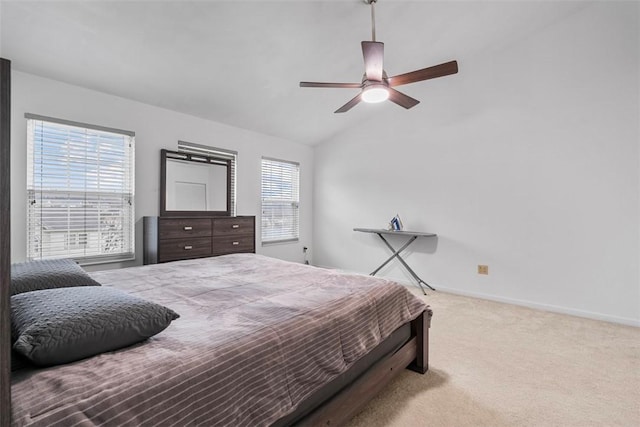 carpeted bedroom featuring baseboards, a ceiling fan, and lofted ceiling