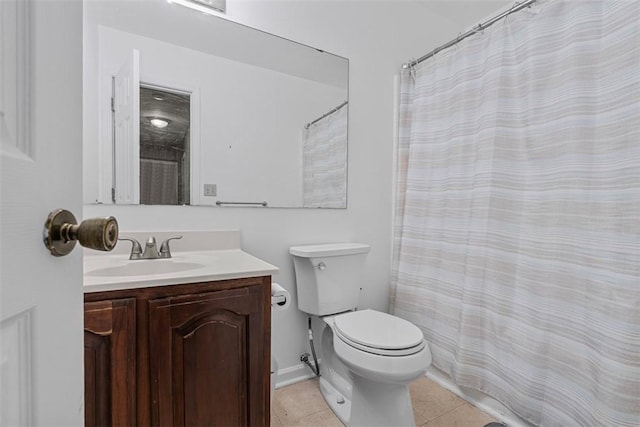 full bathroom featuring toilet, tile patterned floors, and vanity