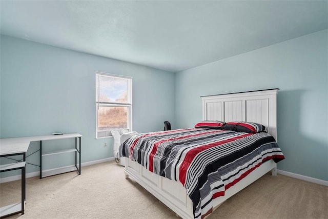 carpeted bedroom with baseboards
