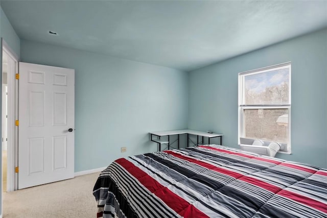 carpeted bedroom with baseboards