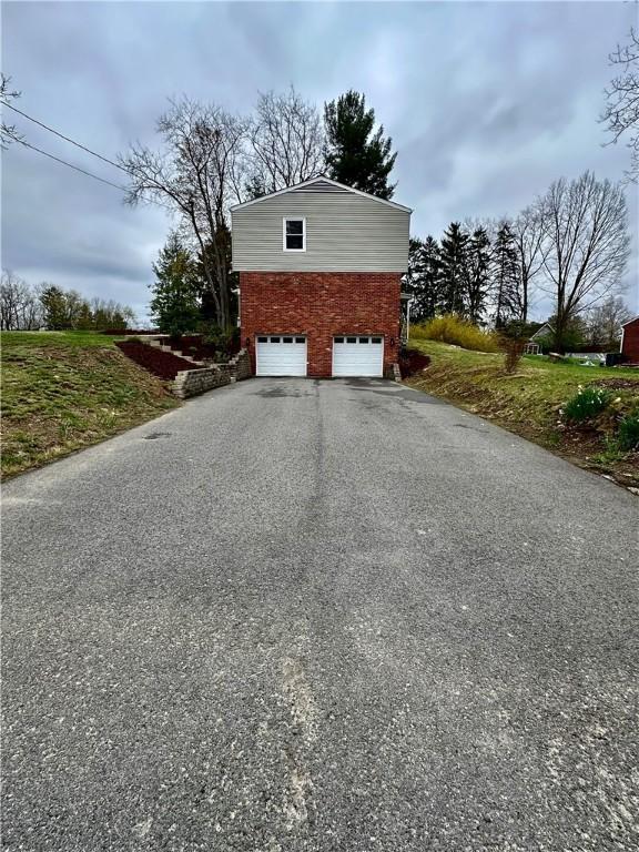 garage with driveway