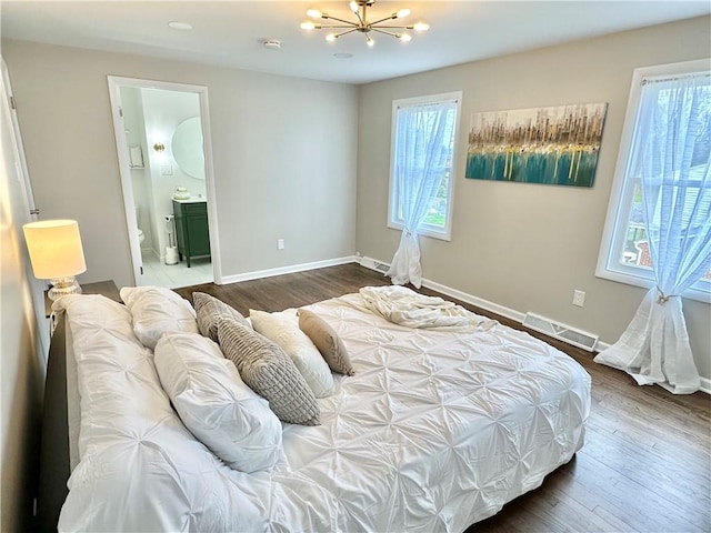 bedroom with dark wood-style flooring, a notable chandelier, multiple windows, and visible vents