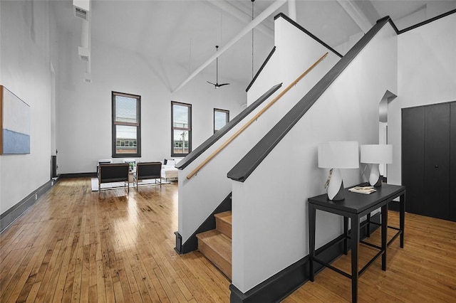 3080 Smallman St, Downtown Pgh, PA 15201 - staircase featuring high vaulted ceiling and wood-type flooring