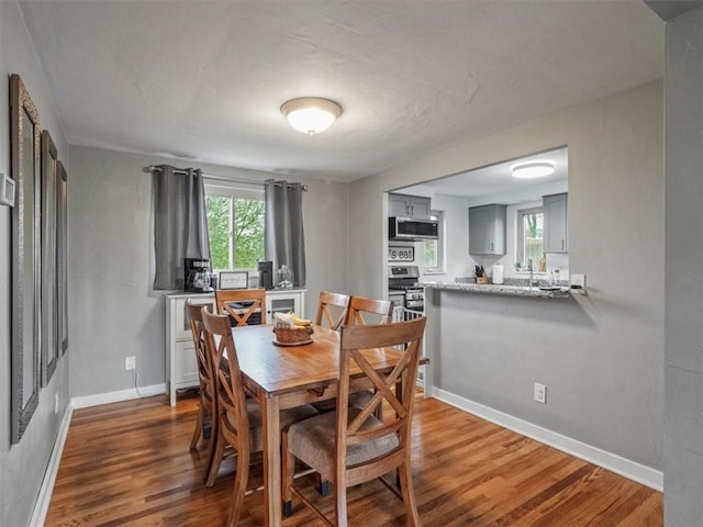 435 Elaine Dr, Baldwin Boro, PA 15236 - dining area with wood finished floors and baseboards