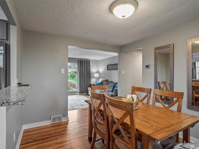 435 Elaine Dr, Baldwin Boro, PA 15236 - dining space with wood finished floors, baseboards, and visible vents