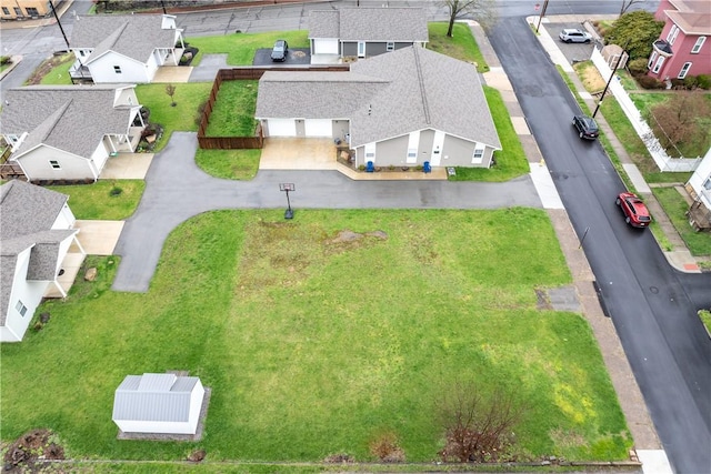 birds eye view of property with a residential view