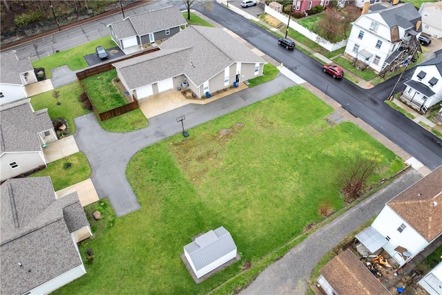 birds eye view of property with a residential view