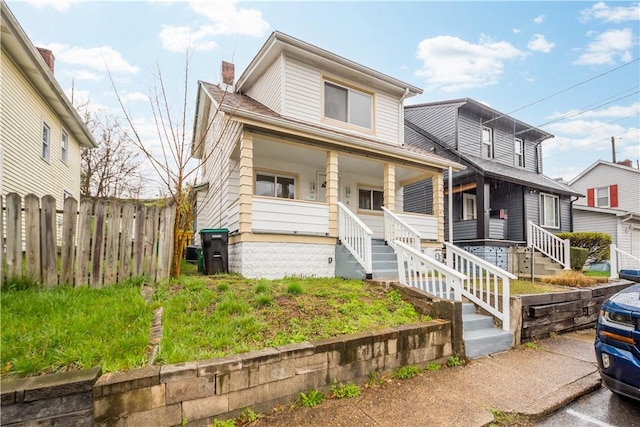 4 Gardner St, Etna, PA 15223 - view of front of home with fence, a porch, and a chimney
