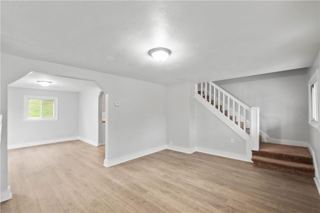 4 Gardner St, Etna, PA 15223 - interior space with baseboards, light wood-type flooring, arched walkways, and stairs
