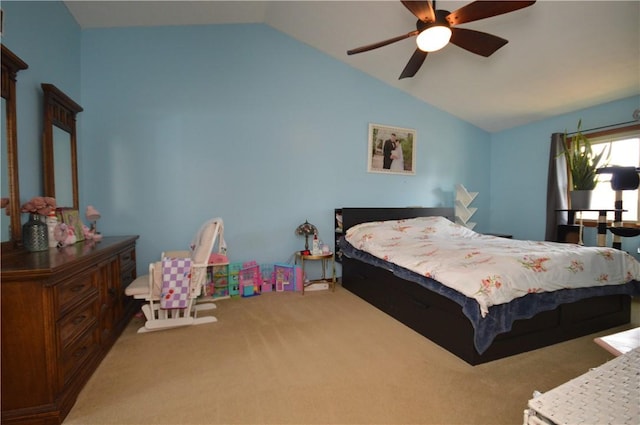 carpeted bedroom with a ceiling fan and lofted ceiling