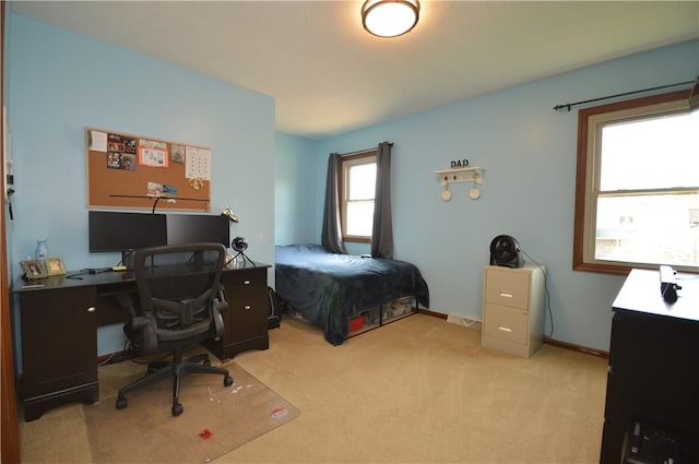 bedroom featuring light carpet