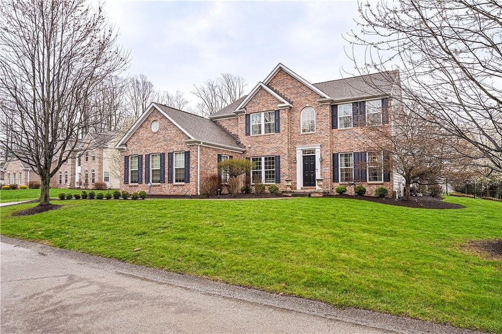 2308 Broomsage Ct, Murrysville, PA 15632 - view of front facade with brick siding and a front lawn