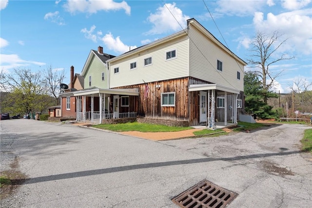 510 Brinton Ave, Pitcairn, PA 15140 - exterior space featuring a porch and a chimney