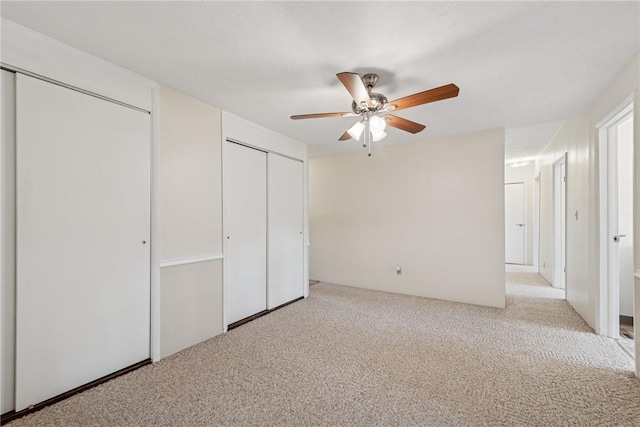 510 Brinton Ave, Pitcairn, PA 15140 - unfurnished bedroom featuring two closets, carpet flooring, and a ceiling fan