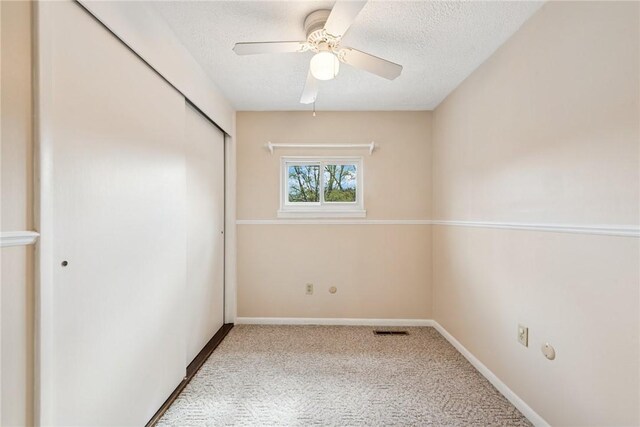 510 Brinton Ave, Pitcairn, PA 15140 - unfurnished bedroom with carpet, visible vents, a closet, and a textured ceiling
