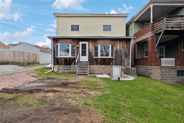 510 Brinton Ave, Pitcairn, PA 15140 - back of property with a yard, entry steps, and fence