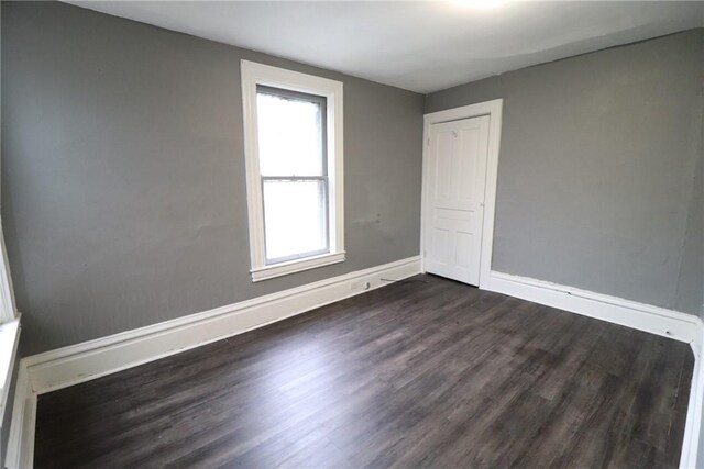 7807 Kelly St, East Hills, PA 15208 - empty room with baseboards and dark wood-style floors