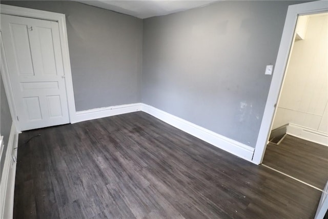 7807 Kelly St, East Hills, PA 15208 - unfurnished bedroom featuring dark wood-style flooring and baseboards