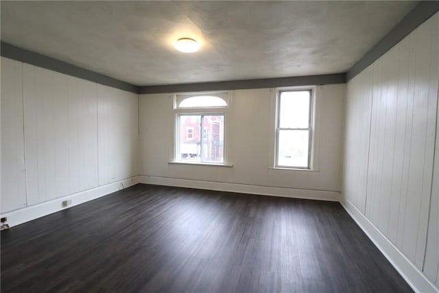 7807 Kelly St, East Hills, PA 15208 - spare room featuring baseboards and dark wood finished floors