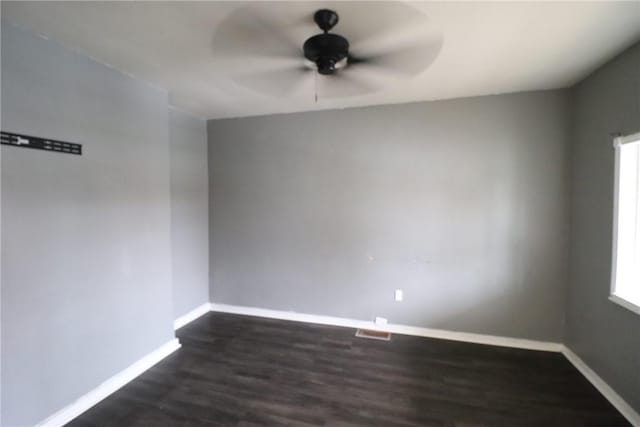 7807 Kelly St, East Hills, PA 15208 - unfurnished room featuring a healthy amount of sunlight, ceiling fan, baseboards, and dark wood finished floors