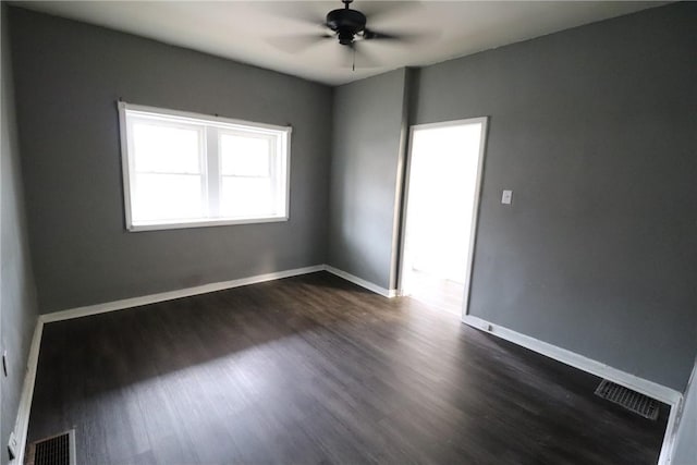 7807 Kelly St, East Hills, PA 15208 - unfurnished room with dark wood-type flooring, visible vents, ceiling fan, and baseboards