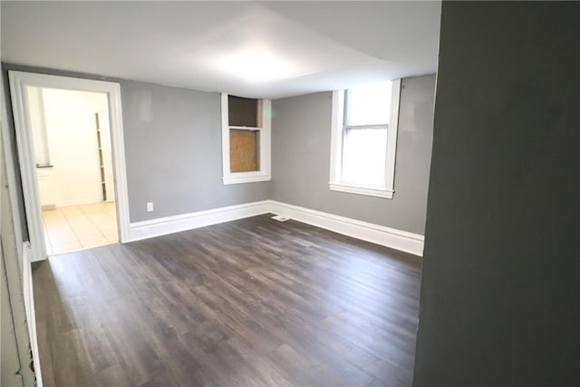 7807 Kelly St, East Hills, PA 15208 - spare room featuring dark wood-style flooring and baseboards