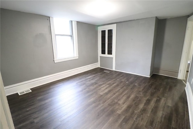 7807 Kelly St, East Hills, PA 15208 - empty room featuring visible vents, baseboards, and dark wood-style floors