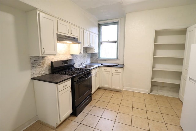 7807 Kelly St, East Hills, PA 15208 - kitchen with white cabinets, a sink, under cabinet range hood, gas stove, and backsplash