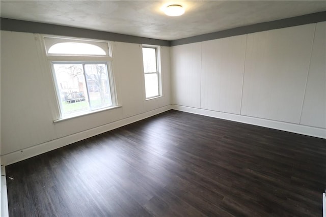 7807 Kelly St, East Hills, PA 15208 - spare room featuring dark wood-type flooring and baseboards