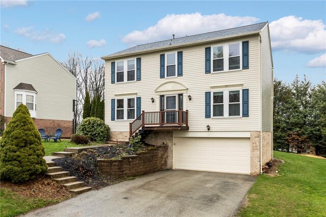 951 Castlegate Cir, Hempfield Twp, PA 15601 - colonial home featuring an attached garage, stairway, driveway, and a front lawn