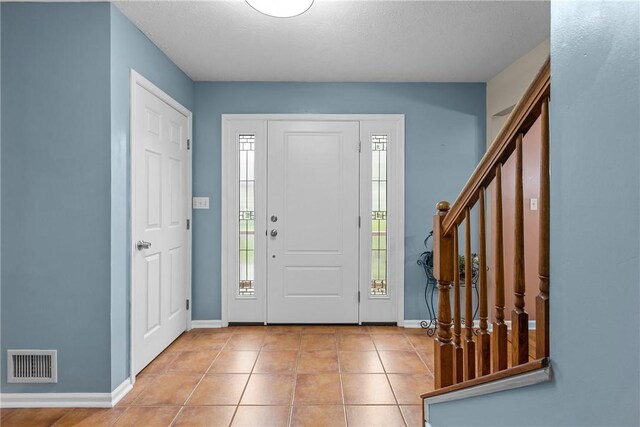951 Castlegate Cir, Hempfield Twp, PA 15601 - foyer entrance featuring stairs and tile patterned flooring