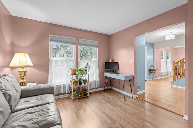951 Castlegate Cir, Hempfield Twp, PA 15601 - living area with stairway and light wood-type flooring