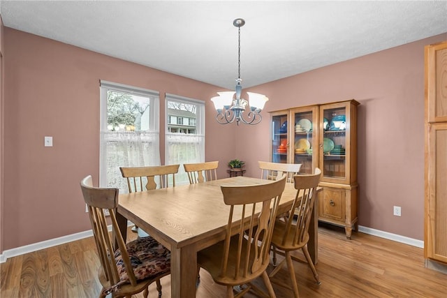 951 Castlegate Cir, Hempfield Twp, PA 15601 - dining room featuring light wood-type flooring and a chandelier