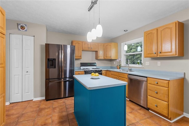 951 Castlegate Cir, Hempfield Twp, PA 15601 - kitchen featuring appliances with stainless steel finishes, light countertops, light tile patterned floors, hanging light fixtures, and a kitchen island