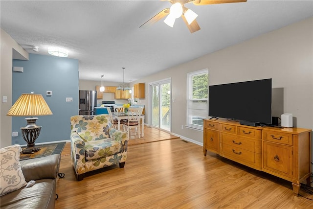 951 Castlegate Cir, Hempfield Twp, PA 15601 - living room with light wood-style flooring and ceiling fan
