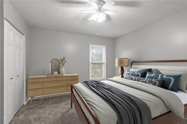 951 Castlegate Cir, Hempfield Twp, PA 15601 - bedroom with dark colored carpet, a closet, a textured ceiling, and ceiling fan