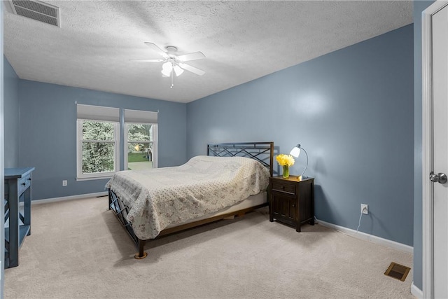 951 Castlegate Cir, Hempfield Twp, PA 15601 - bedroom with light colored carpet, a ceiling fan, and a textured ceiling