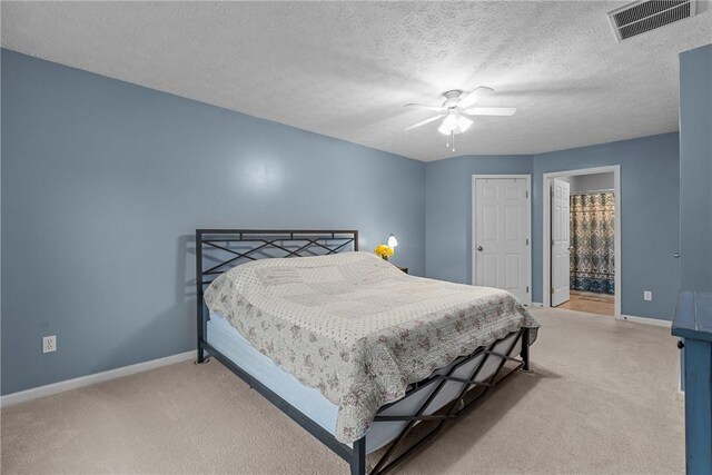 951 Castlegate Cir, Hempfield Twp, PA 15601 - bedroom featuring light colored carpet, a ceiling fan, and ensuite bath
