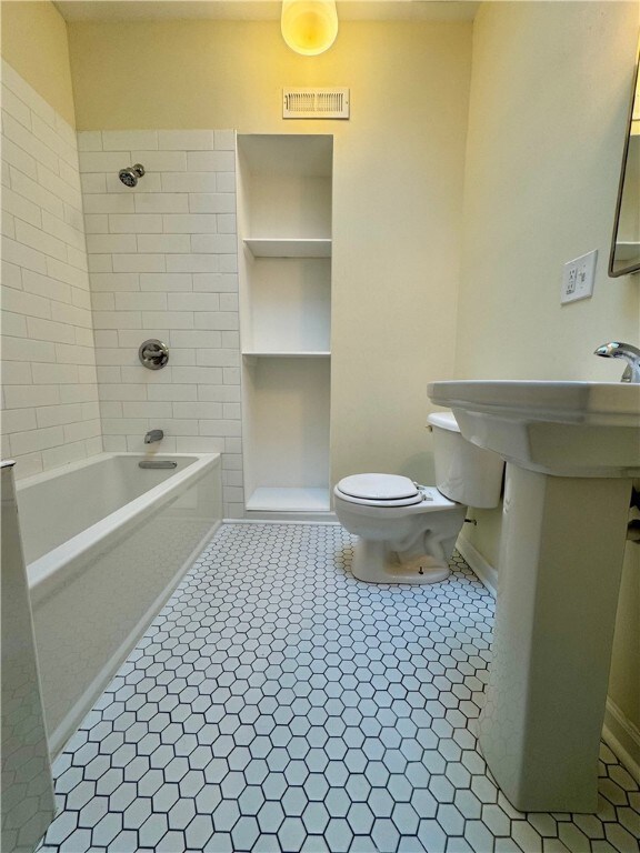 3730 Liberty Ave, Lawrenceville, PA 15201 - bathroom with tile patterned flooring, baseboards, and toilet