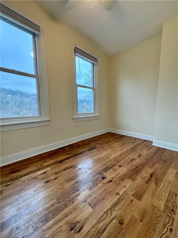 3730 Liberty Ave, Lawrenceville, PA 15201 - empty room featuring baseboards, a ceiling fan, and wood finished floors