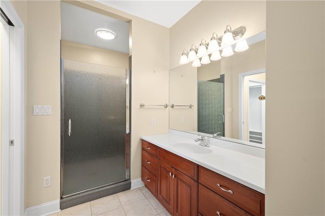 bathroom featuring a shower stall, vanity, baseboards, and marble finish floor