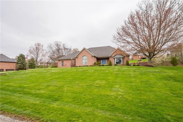 ranch-style home with a front yard