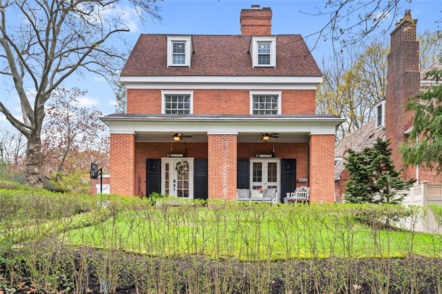 6649 Kinsman Rd, Squirrel Hill, PA 15217 - rear view of property featuring a chimney, french doors, a ceiling fan, brick siding, and a shingled roof
