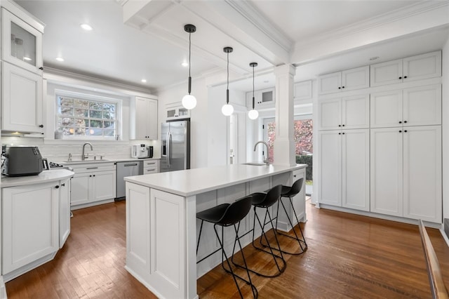 6649 Kinsman Rd, Squirrel Hill, PA 15217 - kitchen with ornate columns, appliances with stainless steel finishes, a sink, and ornamental molding