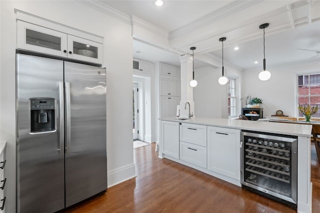 6649 Kinsman Rd, Squirrel Hill, PA 15217 - kitchen featuring dark wood-type flooring, ornamental molding, white cabinetry, beverage cooler, and stainless steel fridge