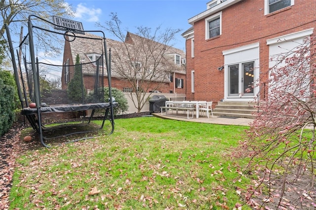 6649 Kinsman Rd, Squirrel Hill, PA 15217 - view of yard with entry steps, a trampoline, and a patio area