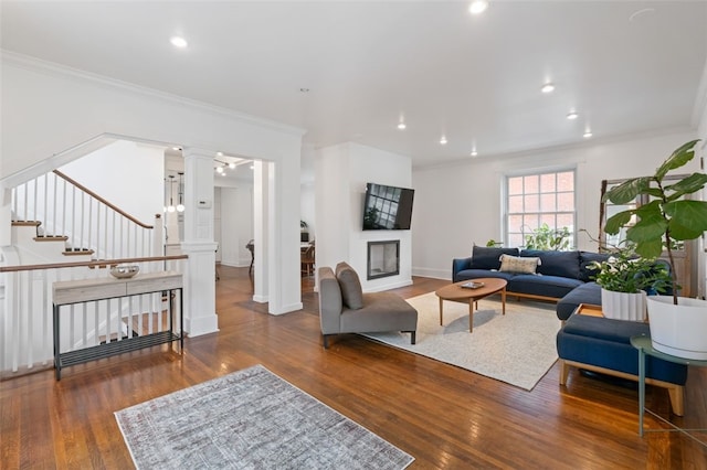 6649 Kinsman Rd, Squirrel Hill, PA 15217 - living room with ornamental molding, ornate columns, and wood finished floors